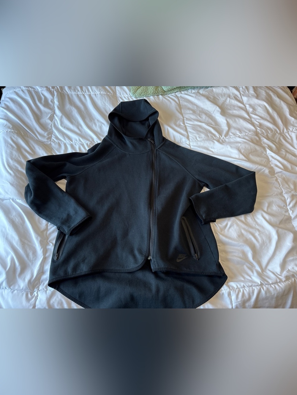 Men’s Nike Tech Fleece full-zip hooded jacket in black.